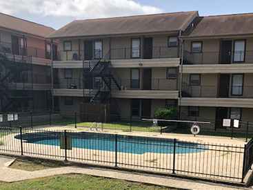 Exterior of Regency Manor apartment complex and pool