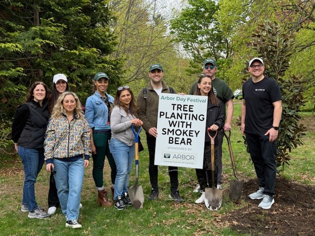 A group of Arbor employees doing tree plantings at Planting Fields Arboretum State Park. 